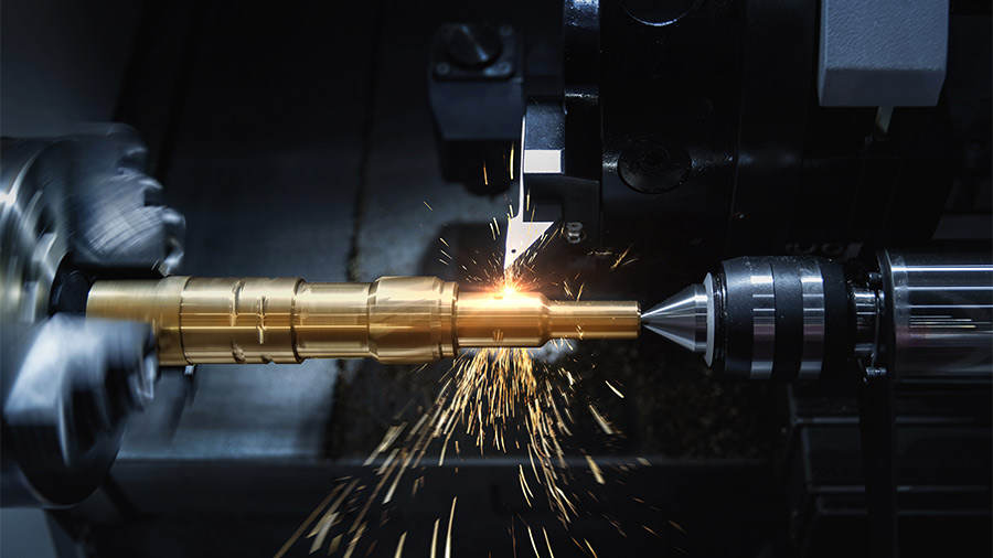 A close up photo of a high-end machining lathe cutting metal