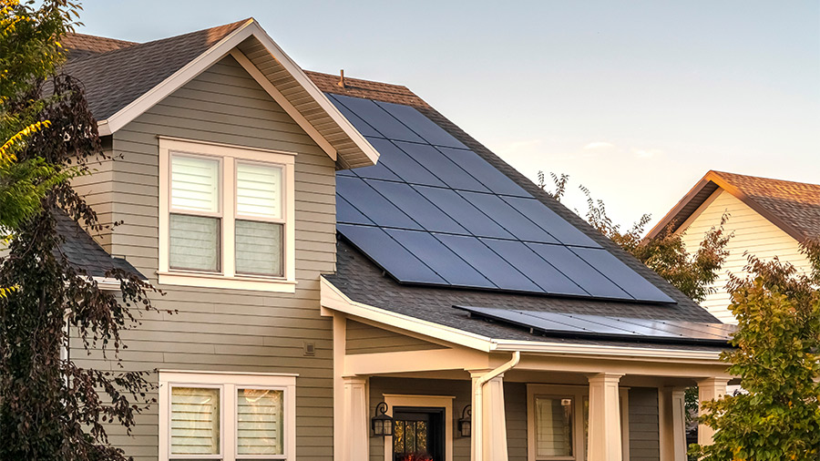 A suburban home with solar panels on the roof