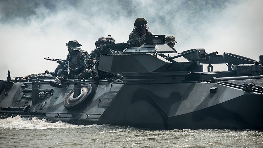 Soldiers mounted on a AAV7 amphibious assault vehicle